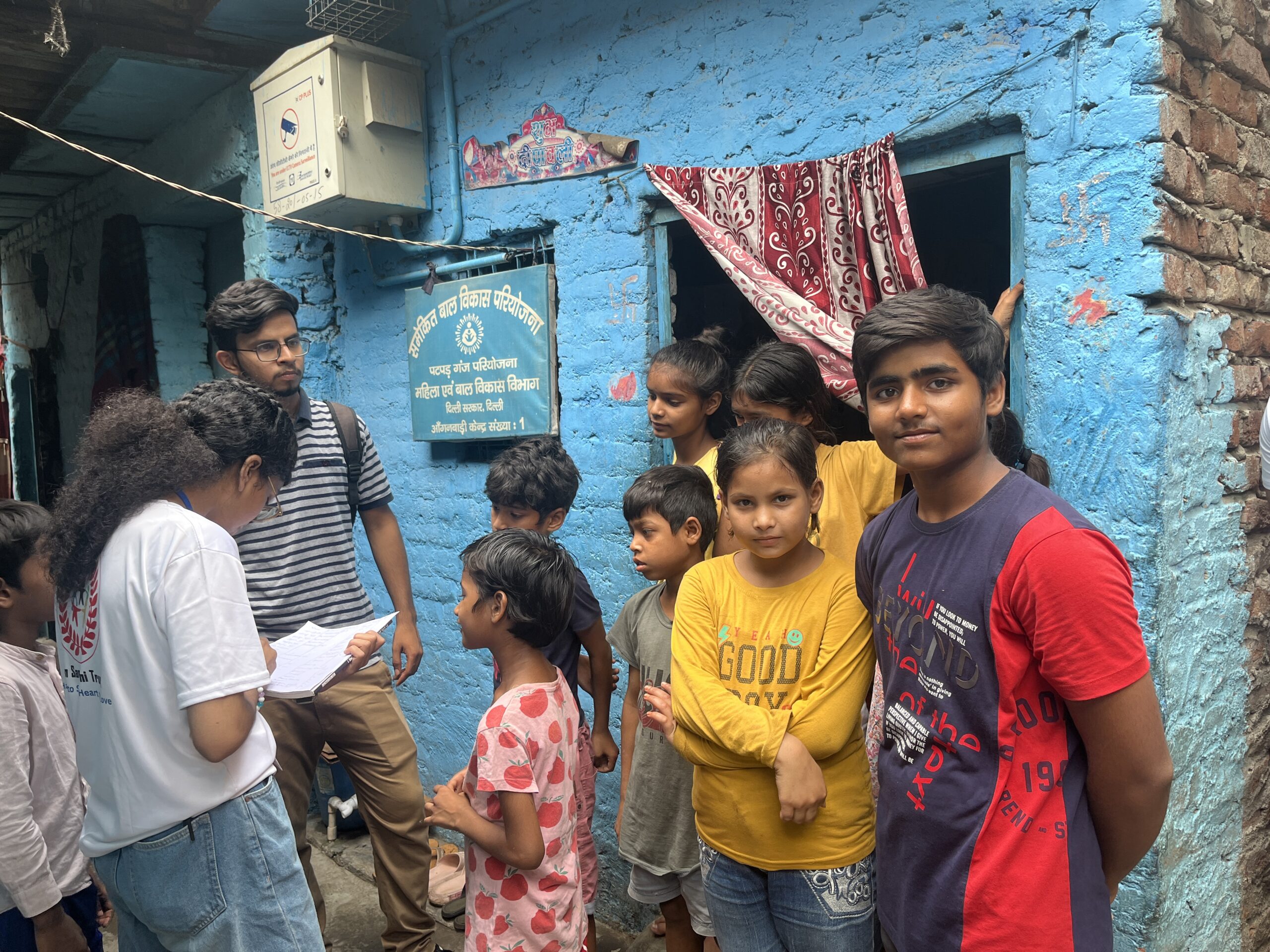 NGO volunteers conducting door-to-door awareness and data collection survey