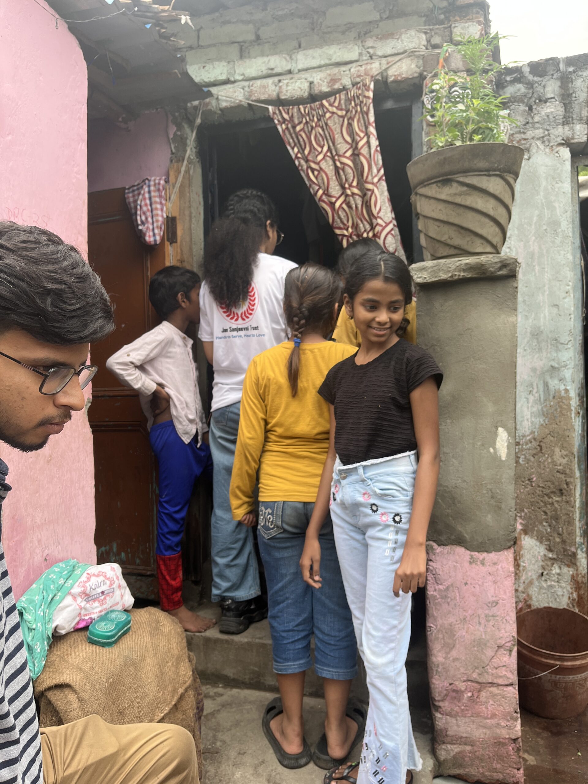 NGO volunteers conducting door-to-door awareness and data collection survey