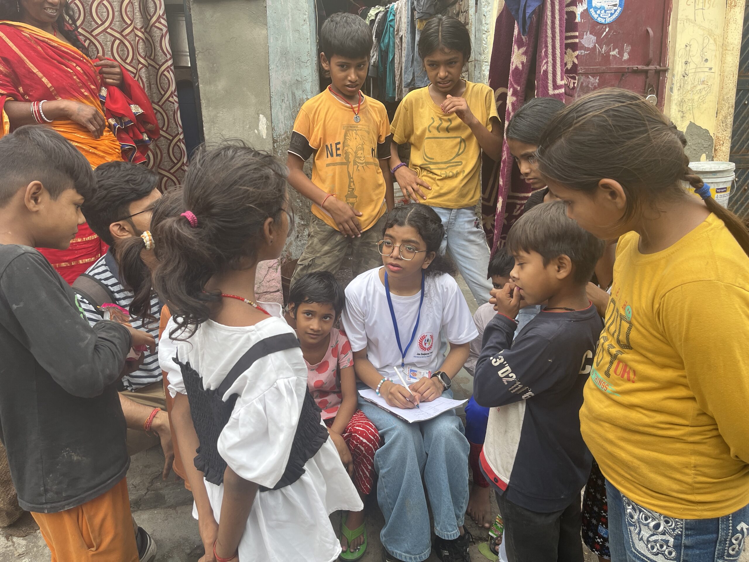 NGO volunteers conducting door-to-door awareness and data collection survey