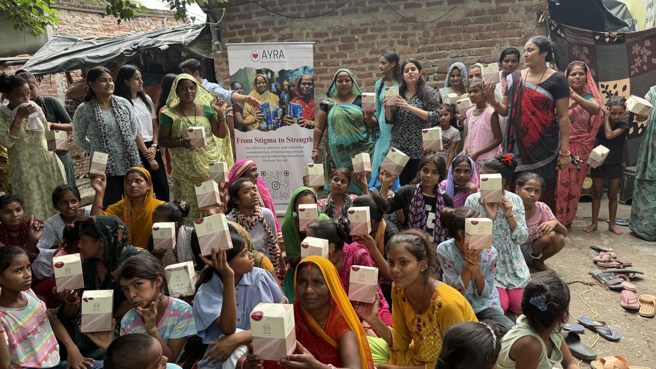 Smiling Women Holding Sanitary Kits