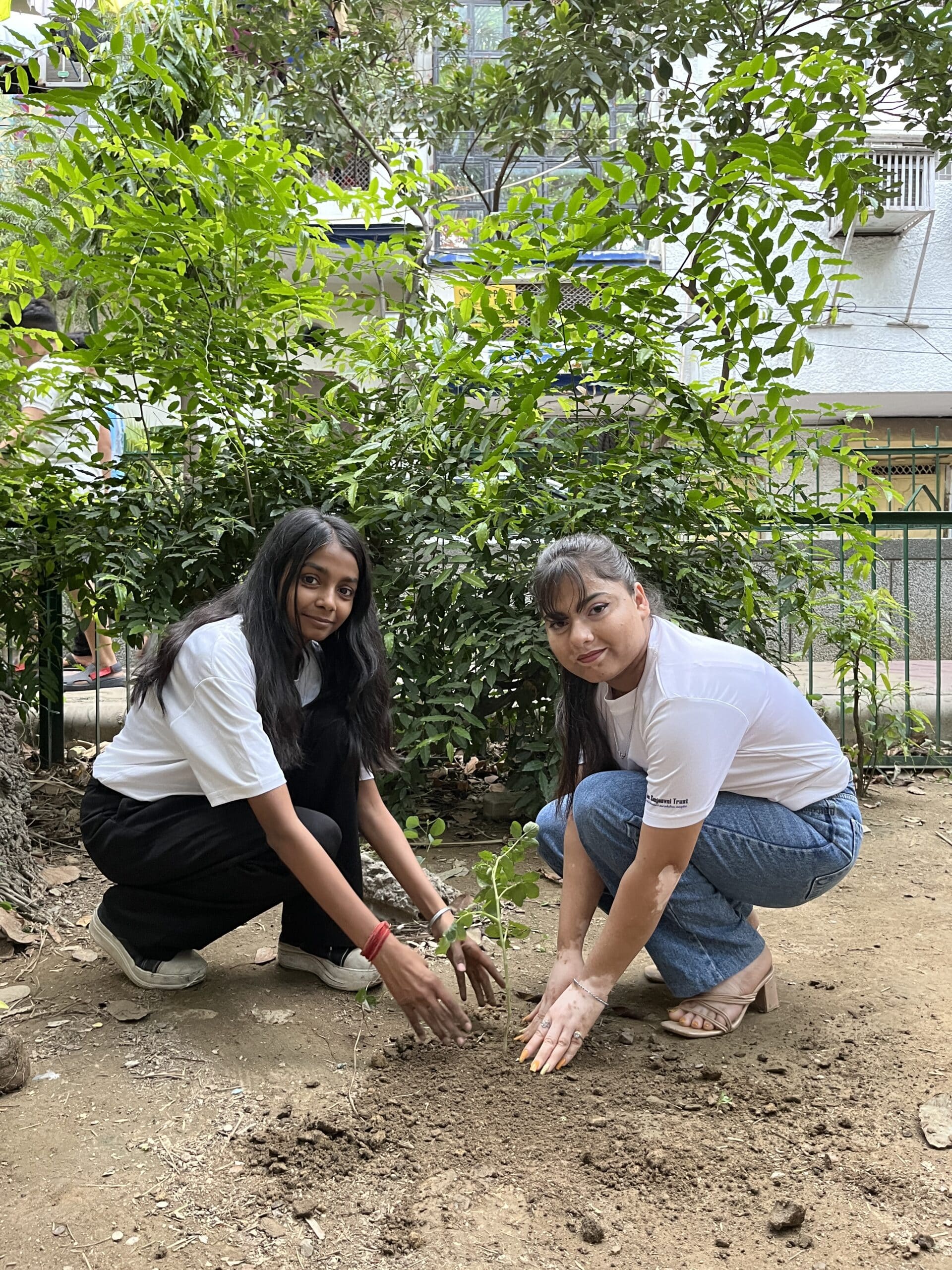 NGO volunteers planting trees during plantation drive in Delhi