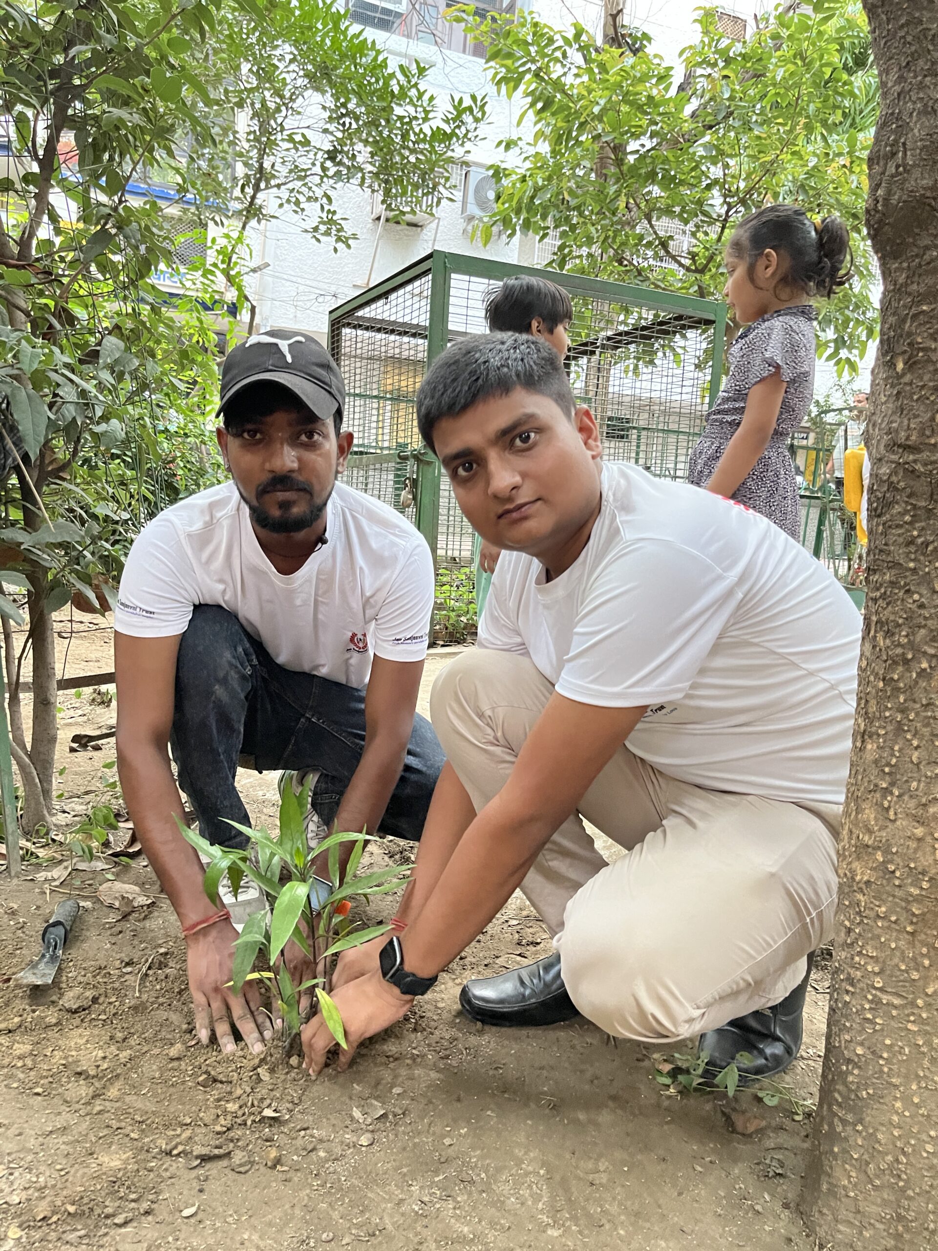 School students participating in tree plantation event by NGO in Delhi