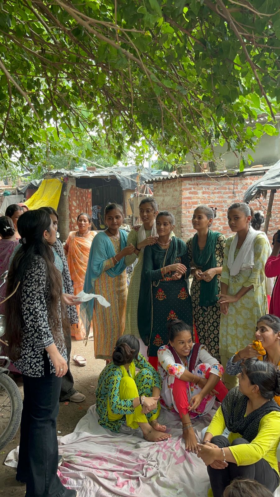 NGO volunteers conducting sanitary pad awareness workshop in community