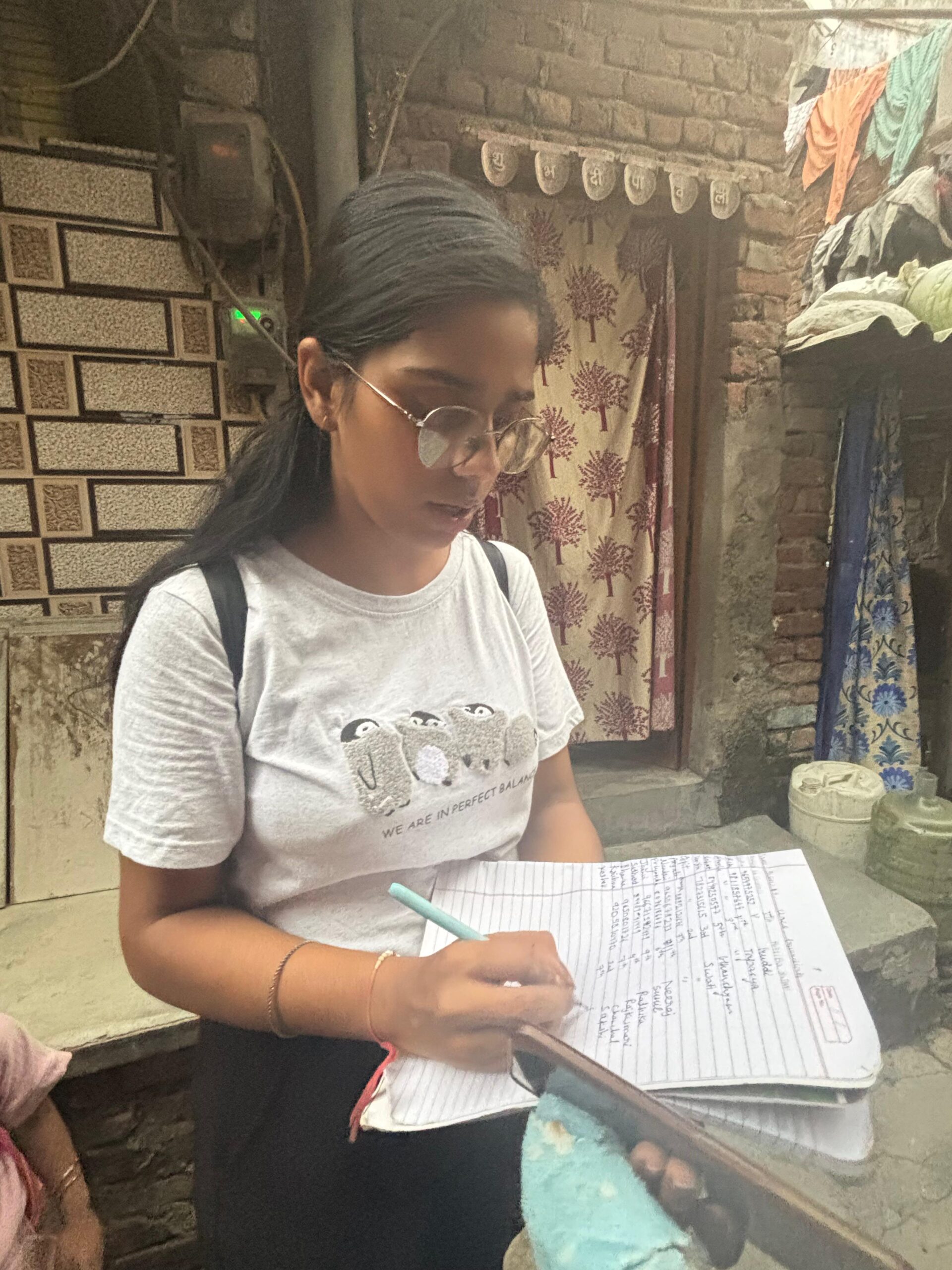 NGO volunteers conducting door-to-door awareness and data collection survey