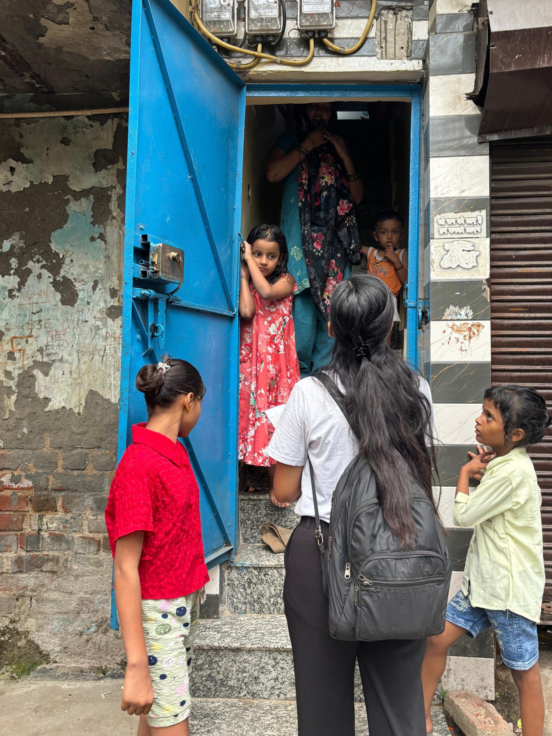 NGO volunteers conducting door-to-door awareness and data collection survey